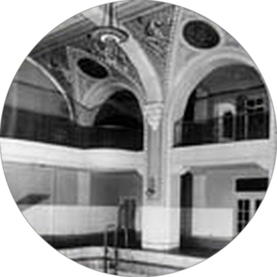 Historic photograph of the Elks Lodge swimming pool beneath its arched ceiling