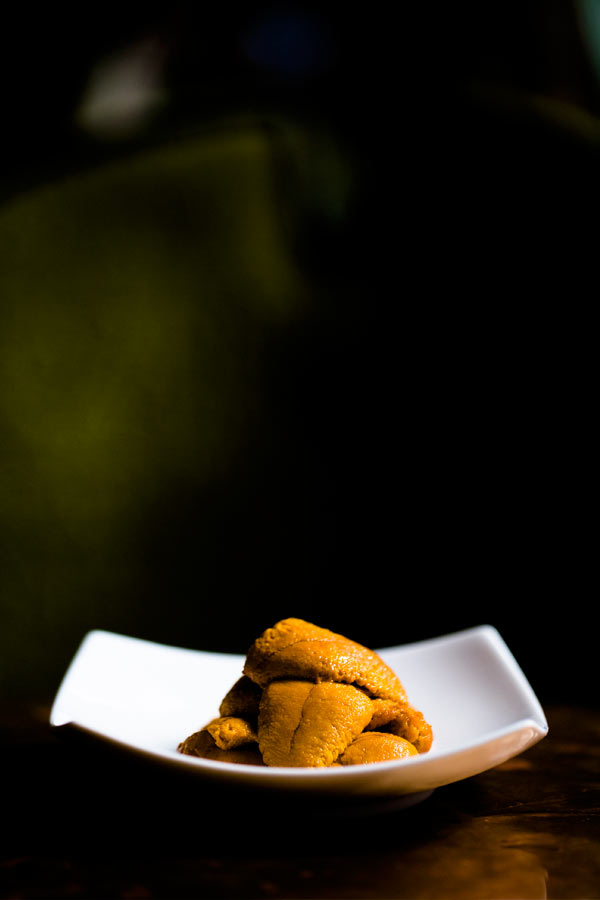 Golden croquettes plated on a dark table