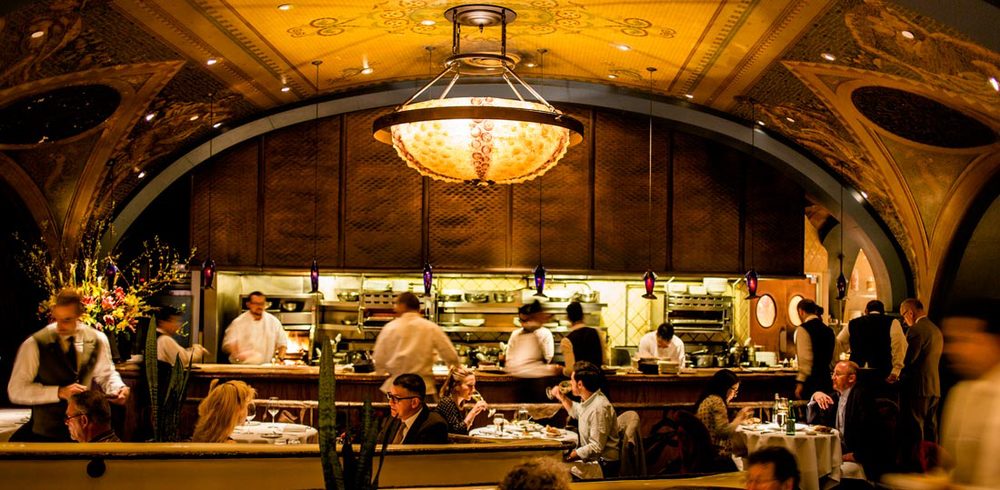 Wide view of the Pool Room and raw bar counter