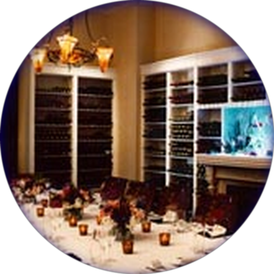 The Sevruga Room set for a private dinner beside its wine library